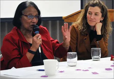  ??  ?? Internatio­nal Women’s Day event guest speaker Bula Ghosh responds to a question from the audience while Keleah Ostrander listens to her answer.