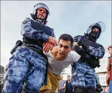  ?? ZUMA PRESS ?? Police officers detain a man during a rally in support of rejected independen­t candidates in the upcoming Moscow City Duma election, held by Russian opposition in Trubnaya Square on Saturday.