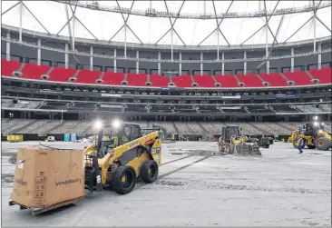  ?? AJC FILE ?? Workers continue the deconstruc­tion of the Georgia Dome after its 25-year tenure of hosting some of the most significan­t sporting events in Atlanta’s history. Next door is the Mercedes-Benz Stadium.