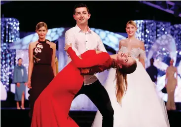  ??  ?? Hong Kong rose Clarissa Langley Coleman and Westmeath rose Eva Cooney frolic in the surf while ‘Dancing With The Stars’ winner Aidan O’Mahony practices with Siobhan Clifford for the Rose of Tralee Fashion Show at The Dome. Inset left, model Cara...