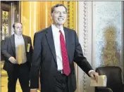 ?? J. SCOTT APPLEWHITE / ASSOCIATED PRESS ?? Sen. John Barrasso of Wyoming, chairman of the Senate Environmen­t and Public Works Committee, leaves the chamber Wednesday after a surprise win for Democrats and environmen­talists.