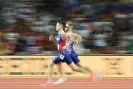  ?? Steph Chambers/Getty Images ?? Josh Kerr (right) passes Jakob Ingebrigts­en to take the lead in the 1500m. Photograph: