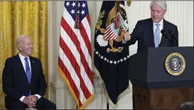  ?? (AP/Susan Walsh) ?? Former President Bill Clinton speaks as President Joe Biden listens during an event in the East Room of the White House on Thursday in Washington to mark the 30th Anniversar­y of the Family and Medical Leave Act. Clinton signed the FMLA into law 30 years ago.