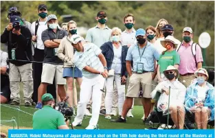  ??  ?? AUGUSTA: Hideki Matsuyama of Japan plays a shot on the 18th hole during the third round of the Masters at Augusta National Golf Club on Saturday in Augusta, Georgia. — AFP