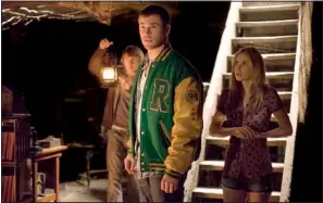  ?? Democrat-gazette file photo ?? Fran Kranz (left), Chris Hemsworth and Anna Hutchison appear in a scene from The Cabin in the Woods. Kranz provides the horror movie’s comic relief.
