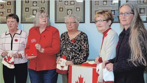  ?? SPECIAL TO THE EXAMINER ?? Christina Pridie and volunteer knitters crafted 150 red and white toques as a Canada 150 project and donated the hats to veterans at the local Royal Canadian legion.