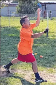  ?? (NWA Democrat-Gazette/Randy Moll) ?? Keng Vang throws a top as he practices before a game of Tuj Lub in Gentry City Park on Aug. 30.