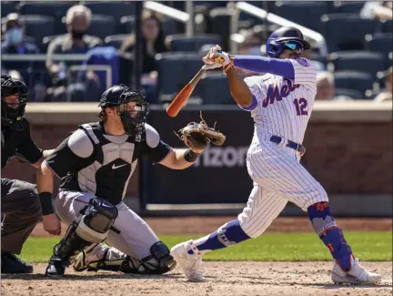  ?? THE ASSOCIATED PRESS ?? New York Mets’ Francisco Lindor hits a single off Miami Marlins starting pitcher Nick Neidert during the fifth inning of a baseball game, Thursday, April 8, 2021, in New York.