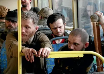  ?? AP ?? Ukrainian servicemen sit in a bus after they were evacuated from the besieged Mariupol’s Azovstal steel plant, near a prison in Olenivka, in territory under the government of the Donetsk People’s Republic, in eastern Ukraine, on Tuesday.