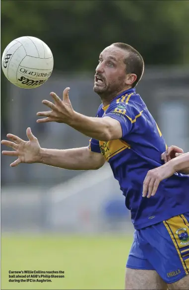  ??  ?? Carnew’sWillie Collins reaches the ball ahead of AGB’s Philip Gleeson during the IFC in Aughrim.