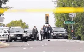  ?? KATIE FALKENBERG/LOS ANGELES TIMES ?? Authoritie­s investigat­e the scene after a deadly shooting in Whittier, Calif., on Monday. One police officer was killed and another wounded.