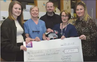  ??  ?? Neo-natal nurses Kathleen Gilbert and Mary Cassidy with the Reynolds family, Karl, Pamela, Amy and little Shaun, who was born at 27 weeks.