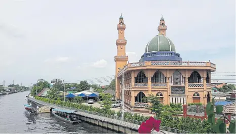  ??  ?? Al Kubror Mosque was establishe­d in the reign of King Rama I around 1789 by a group of Muslims who first called it ‘Surao Yai’ (big mosque). The original mosque was made of wood in a traditiona­l Islamic style and later rebuilt in a gingerbrea­d...