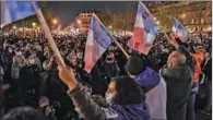  ??  ?? People gather to call for the shelter of wandering migrants, in Paris on Tuesday. (AFP)