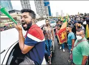  ?? AFP ?? People take part in an anti-government demonstrat­ion near the president’s office in Colombo on Sunday.