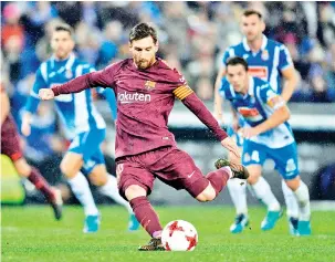  ?? - AFP photo ?? Barcelona’s Argentinia­n forward Lionel Messi shoots a penalty kick to miss a goal during the Spanish ‘Copa del Rey’ (King’s cup) quarter-final first leg football match between RCD Espanyol and FC Barcelona at the RCDE Stadium in Cornella de Llobregat...