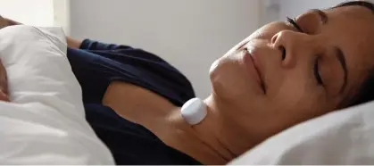  ??  ?? SLEEPING PARTNER: The AcuPebble on the neck records heart and lung vibrations and transmits data to an app