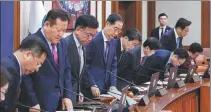  ?? YONHAP ?? Han Duck-soo (fourth from left), prime minster of the Republic of Korea, presides over a cabinet meeting at the government complex in Seoul on Thursday.