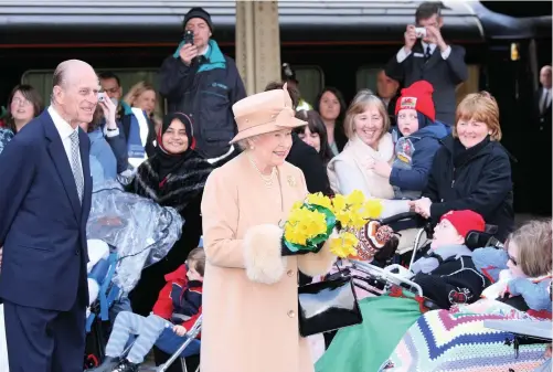  ?? Picture: Anwar Hussein Collection/rota ?? Queen Elizabeth ll and Prince Philip, Duke of Edinburgh meet the public as they arrive by Royal Train on March 7, 2008, in Swansea.