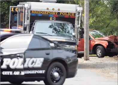  ?? Ned Gerard / Hearst Connecticu­t Media ?? The view looking down Canfield Avenue following a fatal shooting in the Black Rock section of Bridgeport on Sept. 24. Police say a man was killed when multiple gunshots were fired into the car his was driving on Fox Street.