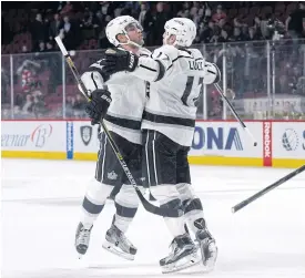  ??  ?? The Kings’ Alec Martinez, left, and teammate Milan Lucic celebrate the win.