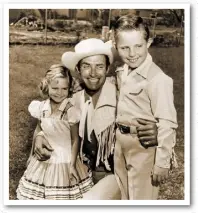  ??  ?? A young Sally Field and her brother Richard with their stepfather, actor Jock Mahoney