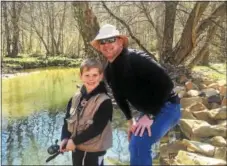  ?? TOM TATUM — FOR DIGITAL FIRST MEDIA ?? Abraham Utecht of Malvern enjoyed Mentored Youth Trout Day on West Valley Creek last year under the watchful, mentoring eye of his father Alex.