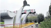  ?? PHOTO: REUTERS ?? Saved . . . A tram crashed through a stop block and landed on an artwork of a whale tail at De Akkers subway station in Spijkeniss­e in the Netherland­s yesterday.