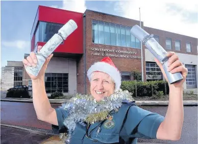  ??  ?? Sara Lace has served Christmas dinner to 40 elderly people at the fire station where she has been based, left, every year since 2013