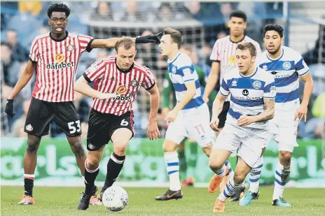  ??  ?? Lee Cattermole tries to get forward from midfield against QPR, with Ovie Ejaria looking on. Pictures by Frank Reid.