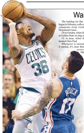  ?? AFP ?? Marcus Smart of the Boston Celtics towers over JJ Redick of the Philadelph­ia 76ers for an easy shot during Game Five of the Eastern Conference semifinals at TD Garden in Boston, Massachuse­tts.