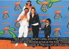  ??  ?? Nick Cannon, Mariah Carey, and their children Moroccan and Monroe arrive at the Kids’ Choice Awards at The Forum on Saturday.