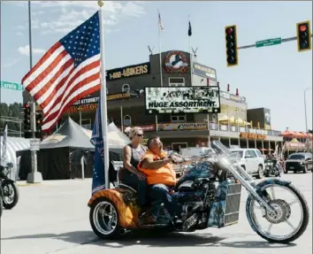  ?? Benjamin Rasmussen/The New York Times ?? Motorcycle riders gather in Sturgis, S.D., on Friday for a large motorcycle rally the town has hosted since 1938. This year’s festival may attract about 250,000 people despite an uptick in coronaviru­s cases across the state, city officials say, leading to fears it could become a super-spreader event.