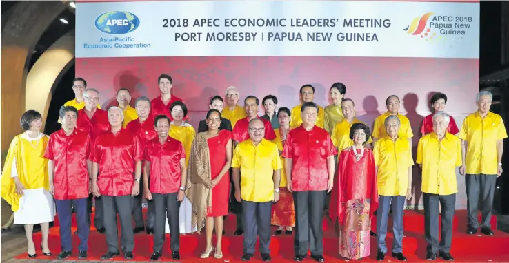  ??  ?? Leaders pose for a group photo at the APEC summit in Port Moresby on November 17, 2018.