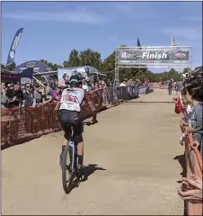  ?? Courtesy photo ?? Graham Nielson finishing the High School Mountain Mike State Championsh­ips