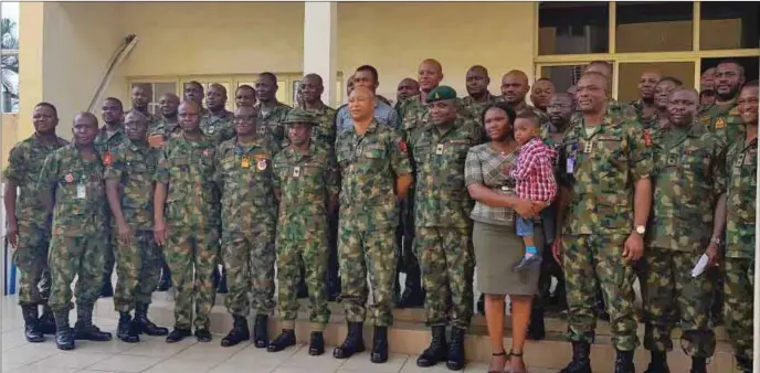  ??  ?? Brig. Gen. Kevin Aligbe with some of the newly decorated officers at 16 Brigade, Yenagoa