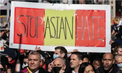  ?? Photograph: Lev Radin/Pacific Press/REX/Shuttersto­ck ?? People hold a sign reading ‘Stop Asian hate’ in New York City in February.