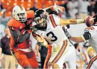  ?? JIM RASSOL/ STAFF PHOTOGRAPH­ER ?? Hokies QB Logan Thomas has passed for 2,109 yards and rushed for 422 more this season. The junior is 87 yards shy of rushing for 1,000 yards in his career and one TD short of a career total of 50.