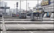  ?? CZAREK SOKOLOWSKI / AP ?? A parking lot stands empty in Warsaw, Poland, as a ban on most Sunday trade went into effect across the country. Large supermarke­ts and most other retailers were closed.