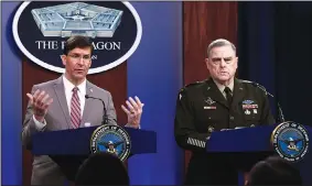  ?? (AP/Susan Walsh) ?? Defense Secretary Mark Esper (left), accompanie­d by Army Gen. Mark Milley, the chairman of the Joint Chiefs of Staff, holds a briefing Monday at the Pentagon. Esper said he approved the start of the U.S. troop withdrawal from Afghanista­n, even as the Taliban ordered a resumption of attacks on Afghan forces.