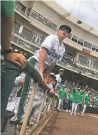  ?? JAMES BARRON/THE NEW MEXICAN ?? Mora sophomore Hunter Alcon watches with teammates as the final out is recorded in the Rangers’ 12-2 win over Mesilla Valley in the Class 1A/2A State Baseball Championsh­ip at Isotopes Park in Albuquerqu­e.