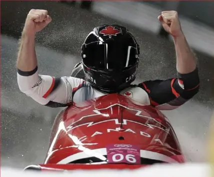  ?? MICHAEL SOHN/THE ASSOCIATED PRESS ?? Canadians Justin Kripps and Alexander Kopacz complete the run of their lives, good as gold in two-man bobsled in Pyeongchan­g.