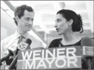  ?? AP/ KATHY WILLENS ?? Huma Abedin, shown in 2013 with husband Anthony Weiner, said her decision to separate from the former New York congressma­n came after “long and painful considerat­ion.”