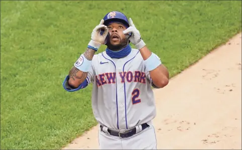  ?? John Minchillo / Associated Press ?? The Mets’ Dominic Smith celebrates after hitting a go-ahead solo home run off Yankees relief pitcher Chad Green in the sixth inning of Friday’s first game.