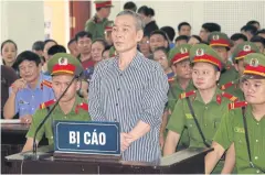  ?? AFP ?? Catholic follower and activist Le Dinh Luong listens to the court verdict in Nghe An province, Vietnam yesterday.