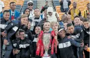  ?? Picture: MUZI NTOMBELA/BACKPAGEPI­X ?? NO JOY: Bidvest Wits developmen­t coach Dillon Sheppard celebrates with the club’s Academy players as Wits were crowned the 2016/2017 Absa Premiershi­p Champions