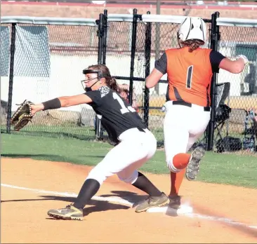  ??  ?? Ridgeland 11, Lassiter 7 Ridgeland first baseman Whitney Boehm stretches out to make a catch and nip LaFayette’s Carlee Corbin. The Lady Ramblers, however, would pull out an 11-7 in the Walker County showdown, keeping them unbeaten and atop the Region...