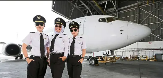  ??  ?? Malaysia Airlines female cadet pilots (from left) Wang, Hidayah and Foo. Malaysian women are getting more opportunit­ies to join the aviation industry as pilots. — Photos: YAP CHEE HONG/The Star