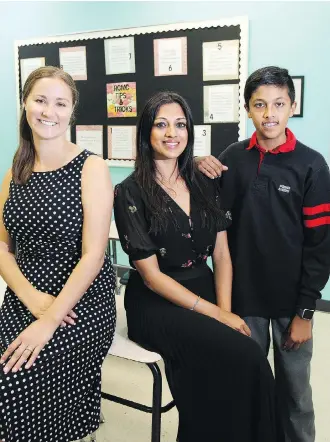  ?? WIL ANDRUSCHAK ?? Webber Academy Grade 7 and 8 teacher Michelle Kacsmarik, left, with parent Komal Dhesi and her son Shaan, who is moving from elementary school to junior high school.