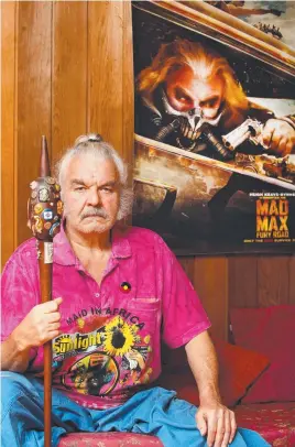  ?? Picture: PETER CLARK ?? Mad Max actor Hugh Keays-Byrne below a poster of himself as Immortan Joe in Fury Road and, below, as Toecutter in the original film.